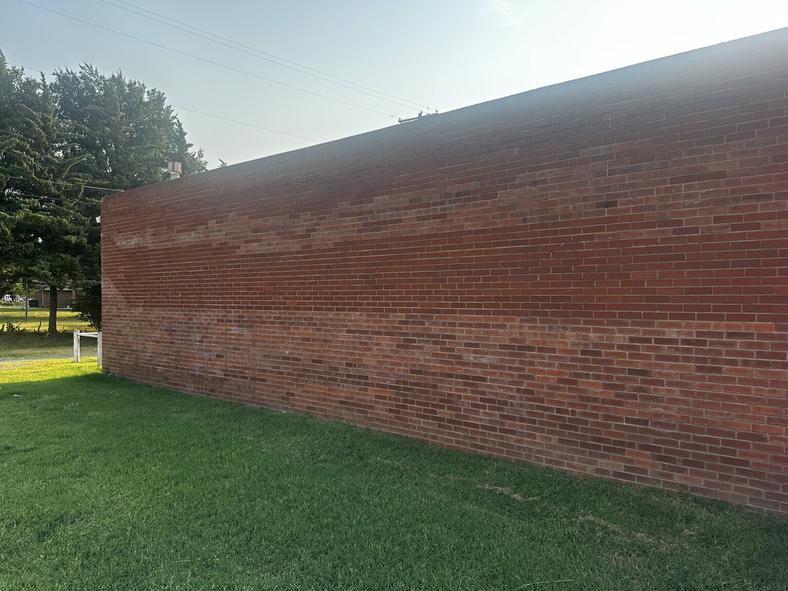 Full brick wall after graffiti removal